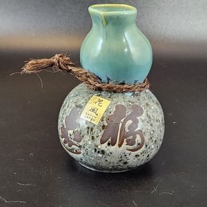 Saki pitcher with signature and label